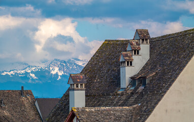 The roofs of the old town of Rapperswil with the snow-capped alps in the background, Rapperswil-Jona, St. Gallen, Switzerland