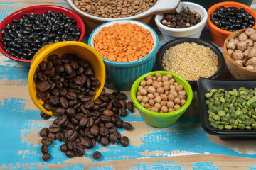 assorted bowls with raw grain and seeds top view