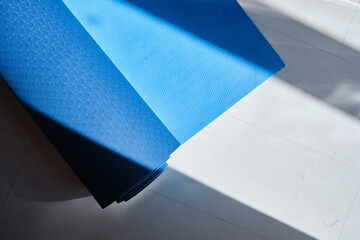 Close-up yoga mat on a light background. Health and sport concept