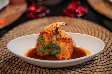 A ready-made dish of fresh red Kamchatka crab legs on the table in the restaurant hall.  Cooked crab meat in a shell on a plate