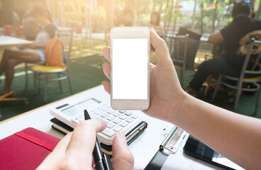 Businesswoman showing blank smart phone screen. girl using smart phone in cafe.
