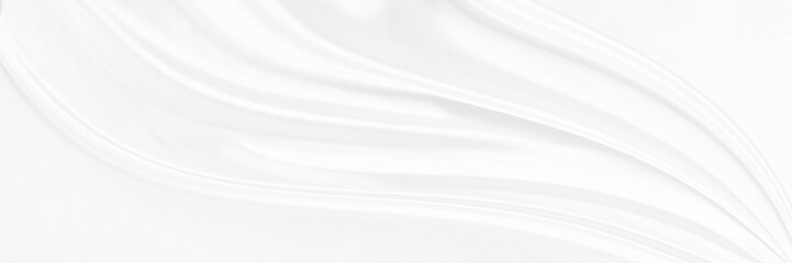 White gray satin texture that is white silver fabric silk panorama background with beautiful soft blur pattern natural.