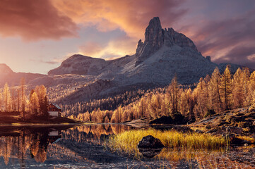 Impressively beautiful Fairy-tale mountain lake in Alps during sunset. colorful Scenery. Panoramic view of beautiful mountain landscape in Alps with Fantastic lake, concept of an ideal resting place. - obrazy, fototapety, plakaty