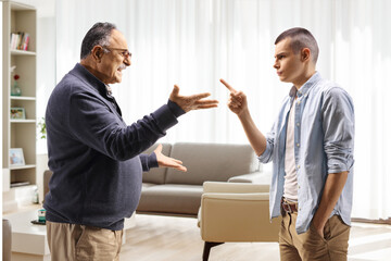 Young man threatening a mature man
