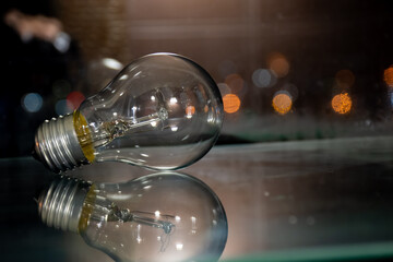 The incandescent lamp is reflected through the glass