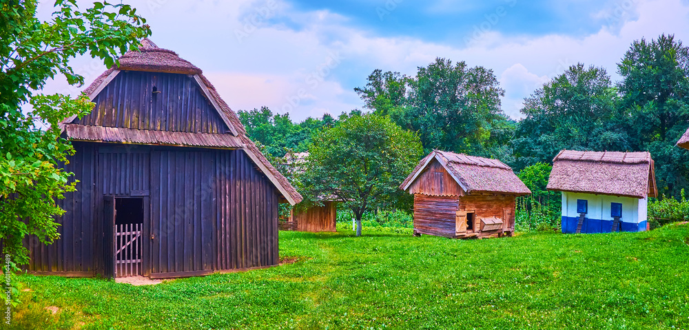 Wall mural The wooden houses and barns of the old farm, Chernivtsi scansen, Ukraine