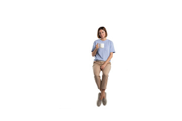 Girl sitting and holding a cup of hot coffee