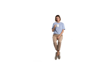 Girl sitting and holding a cup of hot coffee