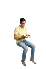 Passionate student sitting and reading a book