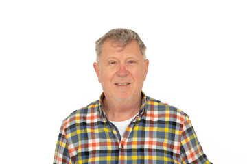 Obraz premium smiling positive looking senior man isolated on white