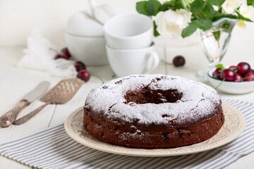 Chocolate pie with cherries.