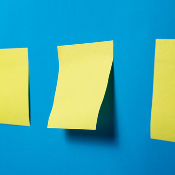 Blank Sticky Notes on Blue Background