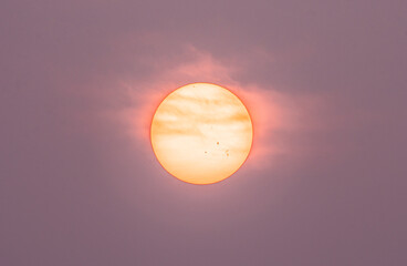 Smoke from Alberta and British Columbia burning wildfires creates hazy sun. Fire and heavy smoke...