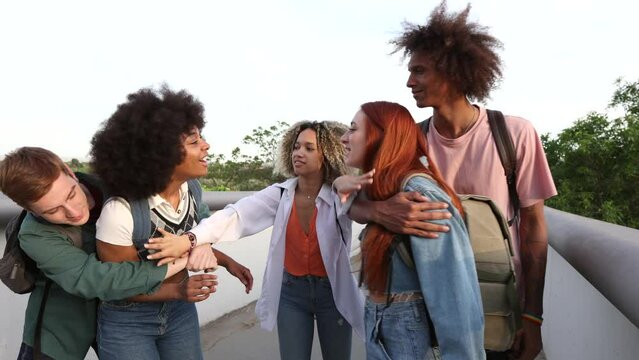Angry girl accusing her sad friend that group of students, bullying, when leaving class
