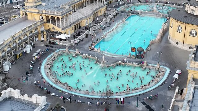 Thermal Bath Szechenyi in Budapest, Hungary. People in Water Pool. Drone Point of View.