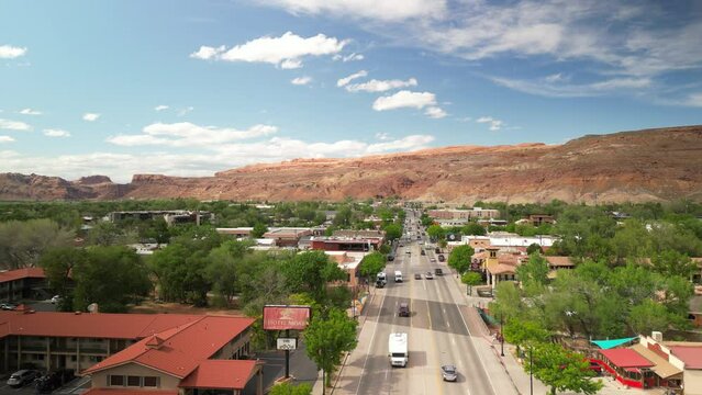 Aerial above downtown Moab Utah in spring time on beautiful sunny day