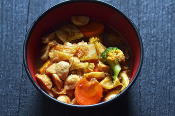 Sauté capcay meatballs on a wooden board