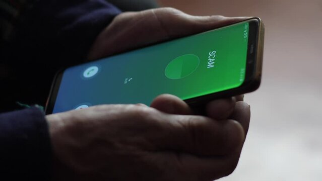 the concept of a telephone scammer calls an elderly person on the phone. deception of a pensioner using mobile applications, fraudulent actions
