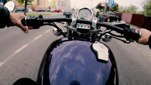 ride on a retro custom motorcycle around the city, first-person view