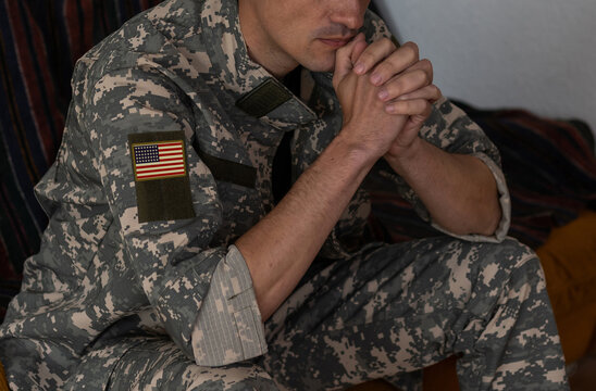 Soldier: Man In Uniform Praying.