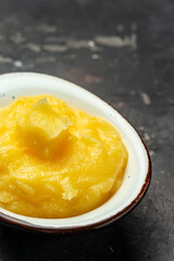 ghee oil. Ghee or clarified butter in jar on a light background. banner, menu, recipe place for text