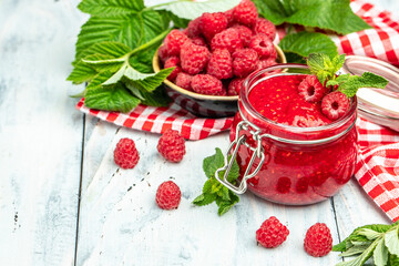 Homemade jam with raspberry on the wooden board. banner, menu, recipe place for text, top view