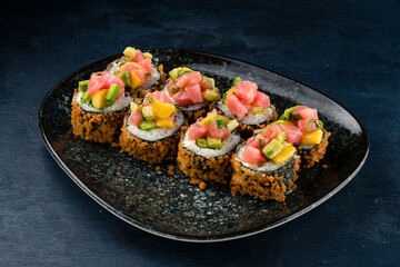 Fried sushi rolls with tuna, cream cheese, avocado, mango, rice and nori.
