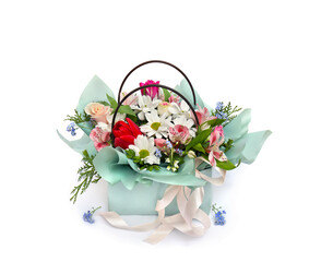 Bouquet of beautiful flowers in green gift box on a white background with space for text. Bouquet of fresh flowers are white chrysanthemum, cream rose, pink and red tulip, blue forget-me-not