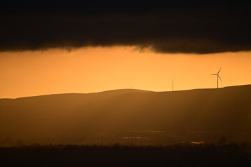 Fototapeta premium wind turbines at sunset
