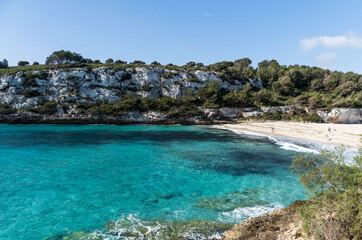 Rear view of blonde woman in cala romantica mallorca, balearic islands