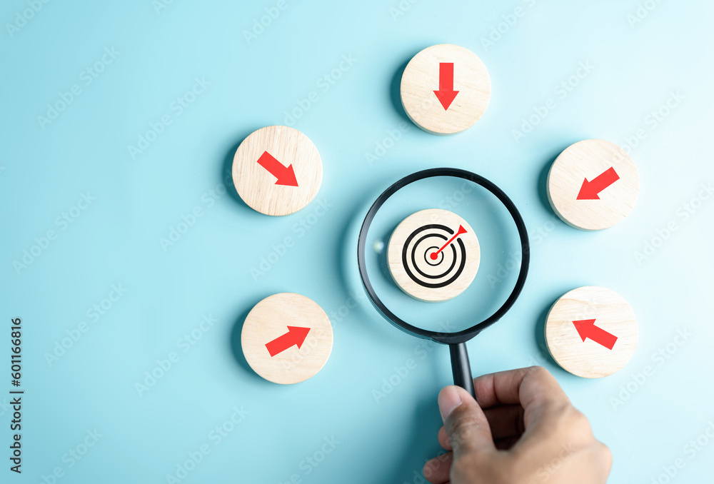 Poster Magnifier glass focus to target icon with arrow to planning and management business development leadership and customer target group.