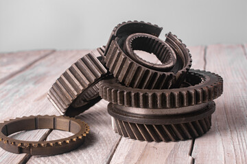 Metal gears of various diameters close-up.