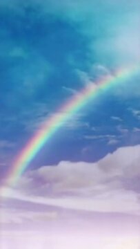 Vertical video Rainbow in cloudy sky timelapse loop, seamless looping animated background motion backdrop sky and clouds, beautiful weather