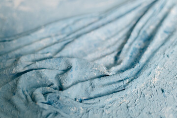 Painting in blue and white modern art. Abstract painting. Gypsum texture. Plaster in the form of waves on canvas. Beautiful modern trendy background.