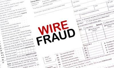 WIRE FRAUD of the box on white sticker and documents