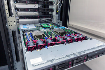 Inside view of opened multiprocessor server in rack frame of IT datacenter.