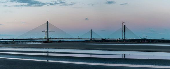 The Mersey Gateway Bridge is a toll bridge between Runcorn and Widnes in Cheshire, England, which spans the River Mersey and the Manchester Ship Canal