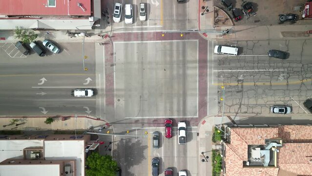 Top down aerial above four way busy intersection on main street in Moab Utah