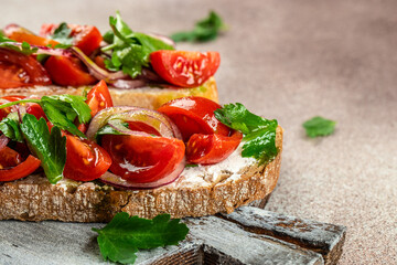 Healthy feta and tomato toast, Italian, Vegetarian or Healthy food concept. Restaurant menu, dieting, cookbook recipe top view