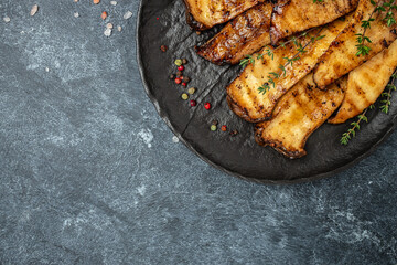 Grilled King oyster mushrooms with thyme on plate. Food recipe background. Close up