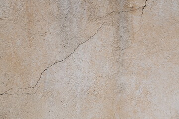 Concrete wall texture with cracks and scratches. Yellow and grey graphic materials	