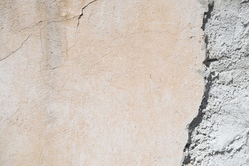 Concrete wall texture with cracks and scratches. Yellow and grey graphic materials	