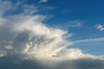 Fototapeta na wymiar large fuzzy cloud in blue sky