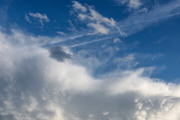 Naklejka na ściany i meble large and small clouds in blue sky