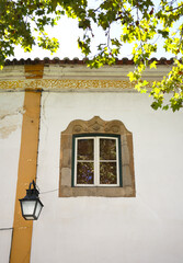 Portuguese facade with beautiful window in Evora