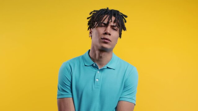 Upset african man, fatal disappointment, failure. Depressed lost guy on yellow