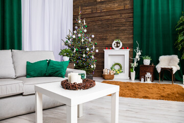 A spacious living room decorated for the Christmas world.