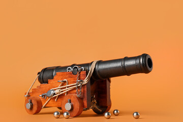 Toy model of cannon on orange background