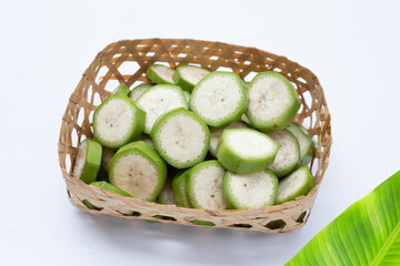 Raw banana slices on white background.
