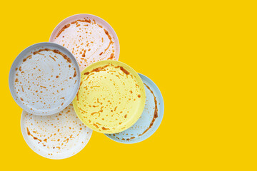 Dirty dishes on yellow background. Top view
